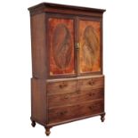 Property of a lady - a George III mahogany, satinwood & inlaid linen press, the oval panelled