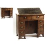 Property of a lady - a George III mahogany & boxwood strung kneehole desk with inset adjustable top,