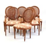 Property of a gentleman - a set of six Louis XVI style cane panelled oval backed dining chairs