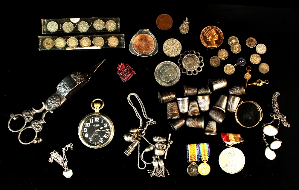 Property of a lady - a bag containing assorted items including silver thimbles & military pocket