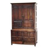 Property of a lady - an 18th century oak two-part press cupboard, with fielded panels & drawers