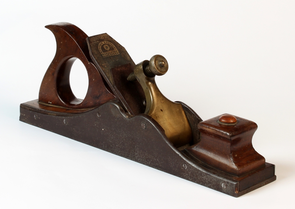 A large 19th century brass mounted fruitwood carpentry plane, the blade stamped 'Moulson