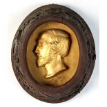 Property of a lady - a 19th century Continental carved oak oval framed gilt painted plaster portrait