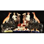 Property of a deceased estate - a pair of Victorian Staffordshire models of figures riding goats,