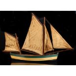 Property of a deceased estate - a carved & painted wood model fishing boat, with linen sails, two