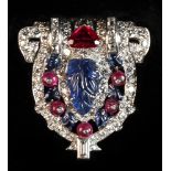 A good Art Deco style sapphire ruby & diamond clip, the central carved unheated Ceylon sapphire