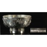 A late 19th / early 20th century Chinese silver bowl decorated in relief with prunus, maker Luen Wo,