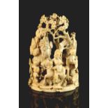 A Chinese carved ivory group depicting three figures among rocks & pine tree, late 19th century, 4.