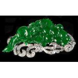 A very rare Chinese carved jadeite plaque depicting a squirrel & grapes, the untreated jadeite of