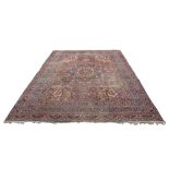 Property of a deceased estate - an early 20th century Meshed carpet, worn, 159 by 109ins. (444 by