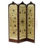 Property of a lady - a late 19th century French carved walnut three-panel screen, with floral