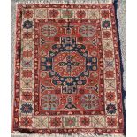 Property of a deceased estate - a Turkish Kazak style rug with pale red fround, 75 by 58ins. (191 by