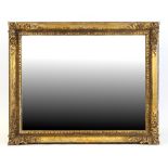 Property of a lady - a large late 19th century carved giltwood rectangular framed wall mirror, 42 by