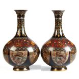 A pair of Japanese cloisonne bottle vases, late 19th / early 20th century, with black grounds, 7.