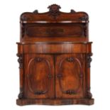 Property of a lady - an early Victorian rosewood serpentine fronted chiffonier, with two doors, on