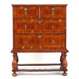 Property of a gentleman - an early 18th century yew wood chest on stand, with brass drop handles,