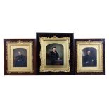 Property of a gentleman - a group of three mid 19th century overpainted portraits, in ornate gilt