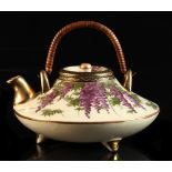 A Japanese Satsuma teapot, Meiji period (1868-1912), painted with wisteria, 2-character mark to