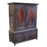 Property of a deceased estate - an 18th century George III oak two-part clothes press cupboard, with