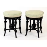 Property of a lady - a pair of late Victorian carved & ebonised circular topped adjustable piano