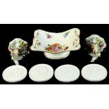 Property of a lady - a set of four Royal Copenhagen biscuit porcelain circular relief plaques