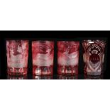 A set of three 19th century Bohemian etched cranberry glass beakers, decorated with deer in