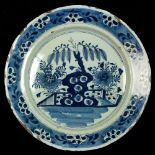 Property of a gentleman - an 18th century Dutch Delft blue & white plate, painted with fenced shrubs