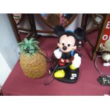 A Novelty Telephone Modelled as a Walking Mickey Mouse with Backpack, and a plastic pineapple ice