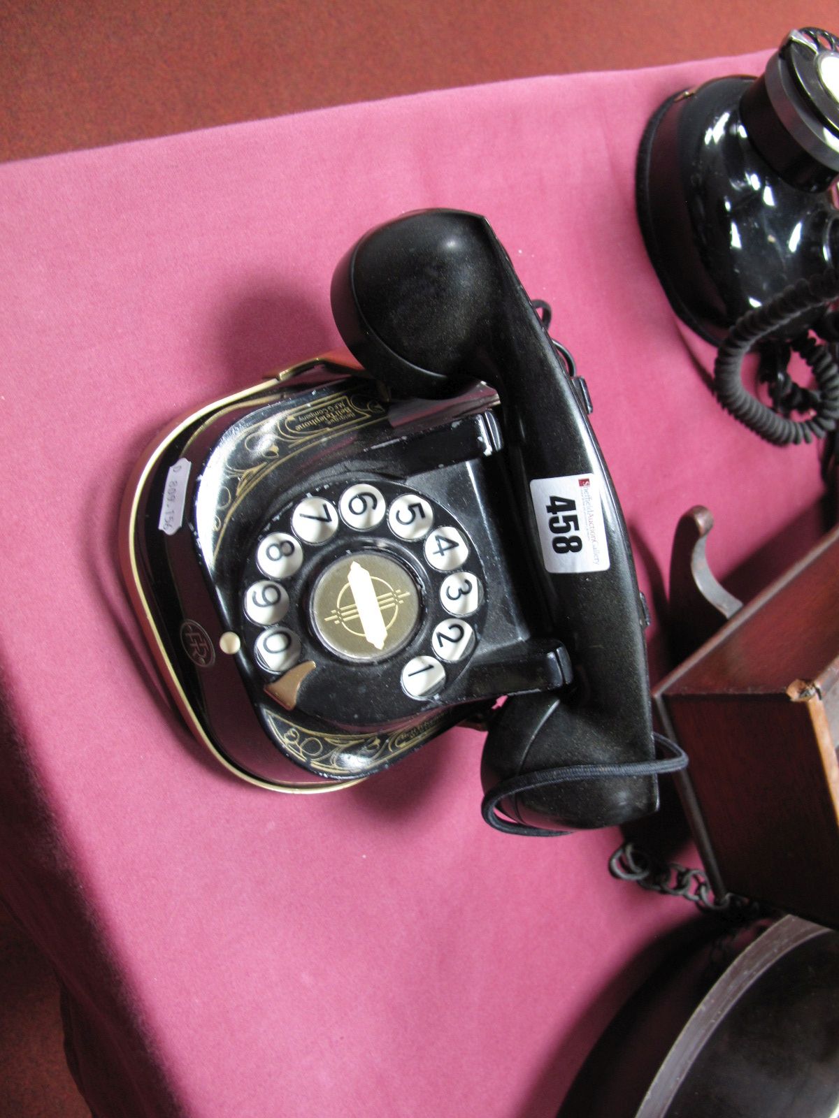 A c. Mid XX Century Bell Telephone, marked "BELGIQUE F.T.R.", brass handle, black and gilt decorated