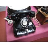 A Mid XX Century Black Bakelite Extension Telephone, of anvil form, stamped "44 C/1" under base.