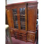 A Mahogany Breakfront Cabinet, top with dentil cornice over central glazed astragal doors,