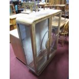 A Walnut Art Deco Display Cabinet, with astragal circular centre to twin glazed doors, on plinth