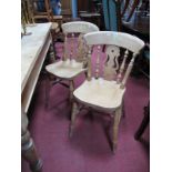 A Set of Four Wooden "Country Style" Kitchen Chairs, shaped bar back over central pierced vase splat