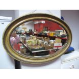 An Early XX Century Bevelled Glass Oval Wall Mirror, in a moulded antiqued frame, and a "Venetian"