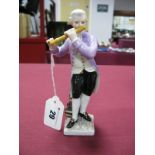 An Early XX Century German Porcelain Figure of a Flautist, standing beside a pile of books, square