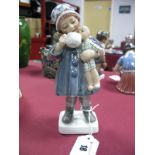 A Dahl Jensen Copenhagen Porcelain Figure, a girl with doll, model number 1106, printed and