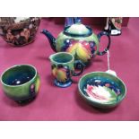 A Moorcroft Pottery Leaf and Berry Pattern Three Piece Tea Service, comprising teapot and cover,