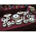 A Royal Doulton "Carlyle" Pattern Dinner Service, comprising two oval tureens, five dinner plates,