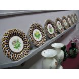 A Part Set of Eight Victorian China Dessert Plates, of shaped circular form, each polychrome painted