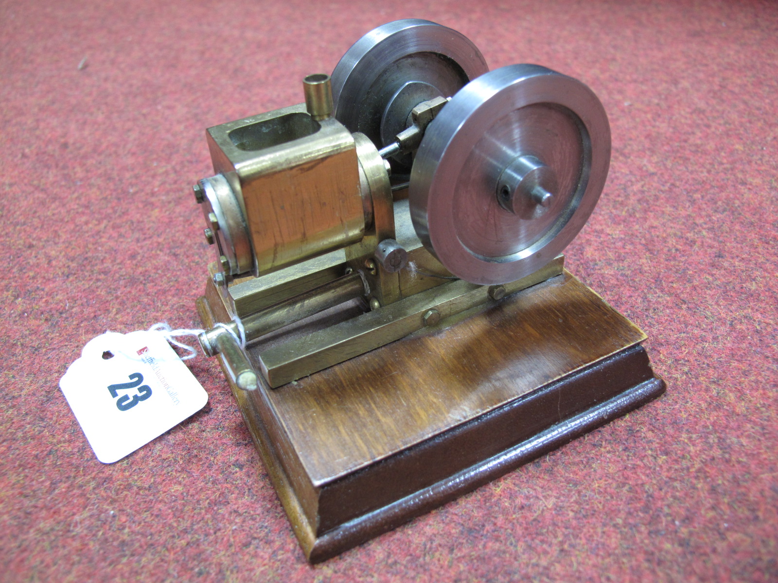 A Small Water-Cooled Vacuum Engine. Model of brass and steel on a wooden plinth. ½ inch bore and ¾