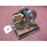 A Small Water-Cooled Vacuum Engine. Model of brass and steel on a wooden plinth. ½ inch bore and ¾