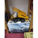 A 1:50th Scale Model of a Liebherr T284 Mining Truck by Conrad. Finished in yellow. As new. Boxed.