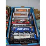 Nine Boxed Diecast and Plastic Lorries by a Variety of Manufacturers, including American outline