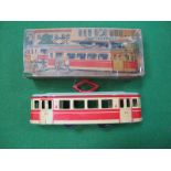 A Mid XX Century Tinplate Tram, friction drive, made in Germany, finished in orange and cream. In