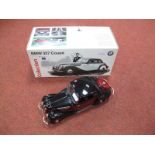 A Boxed Modern Schuco 1:18 Scale Pressed Steel Clockwork BMW 327 Coupé, in maroon and black, with