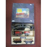 A Post War Hornby Clockwork MI Passenger Set. Comprising an 0-4-0 locomotive and tender and two