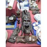 A Carved Hardwood Tribal Face Mask, stylized facial motif decoration below an elephant head,