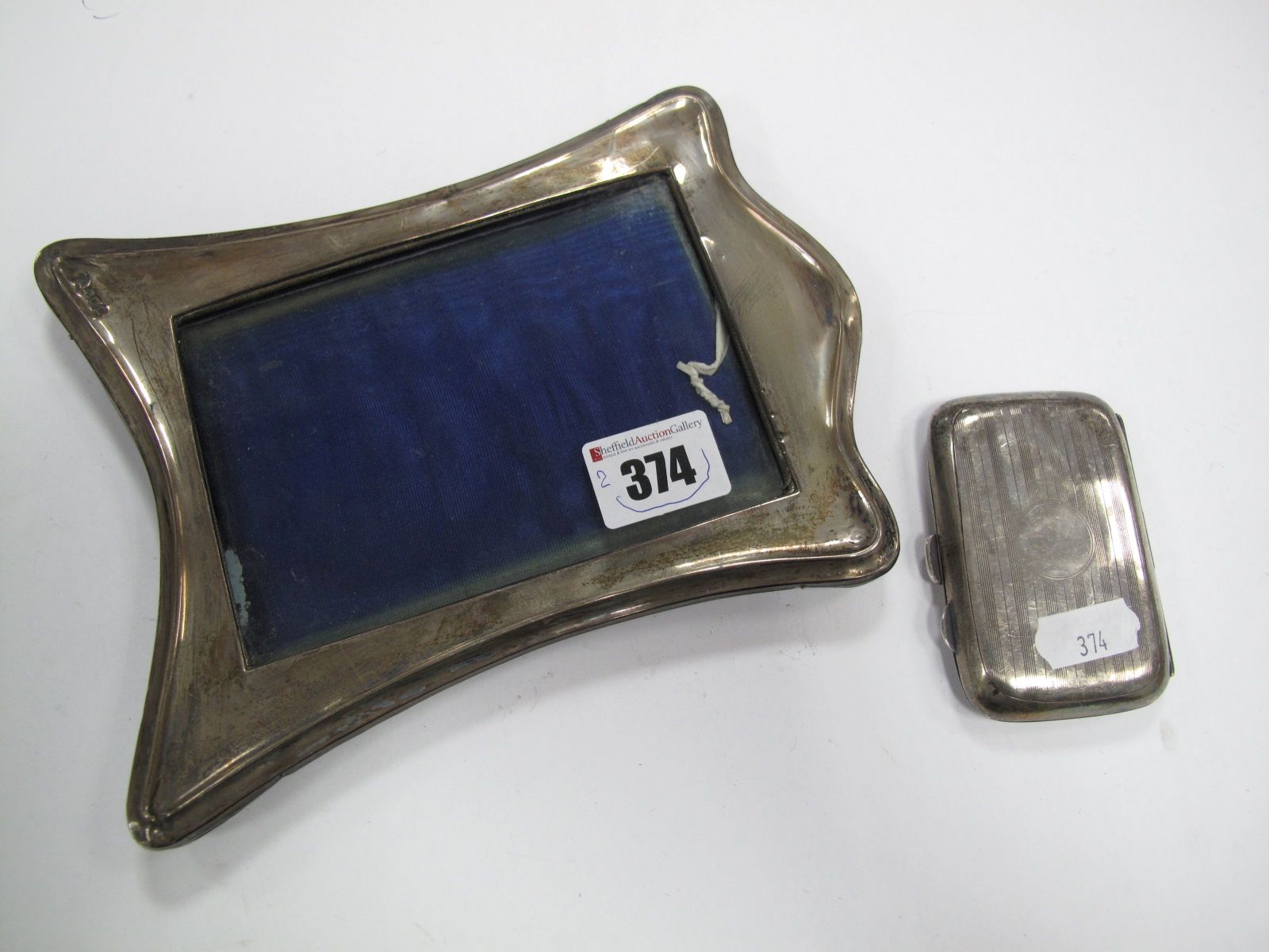 A Hallmarked Silver Cigarette Case, engine turned, together with a hallmarked silver mounted