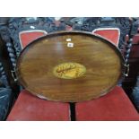 An Edwardian Mahogany Oval Serving Tray, raised wavy edged gallery and twin brass handled, central
