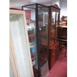 A Floorstanding Display Cabinet, four glazed sides, with five display shelves over open single lower